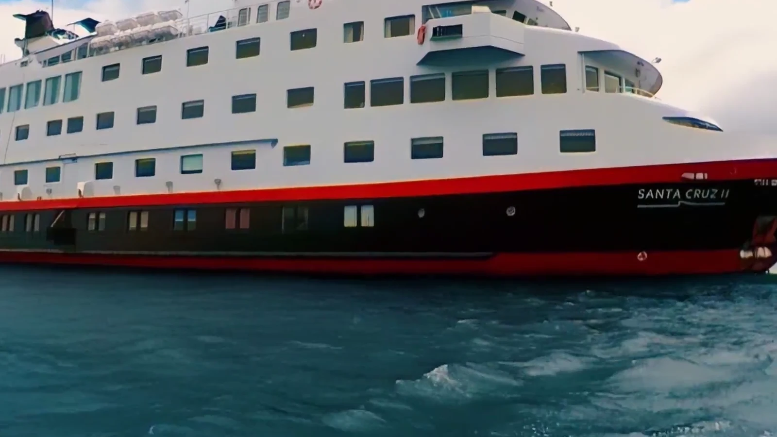 Hurtigruten expedition ship on bright Galápagos waters, still from the 360 film