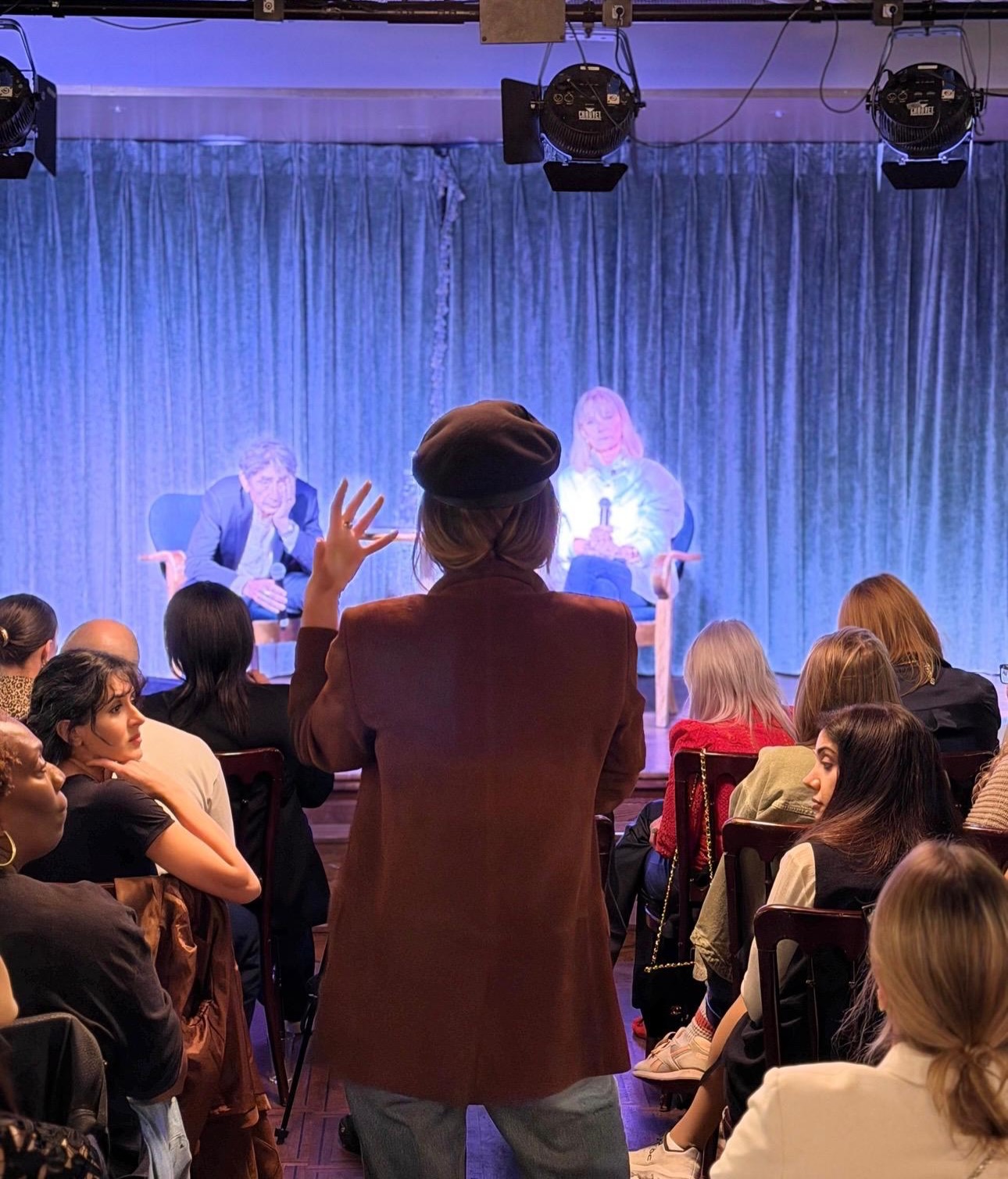 An audience member standing in the aisle to ask a question during the Prime Time Reset conversation with Dr Gabor Maté