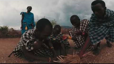Maasai families take part in a story activity in a scene from the 360 headset experience