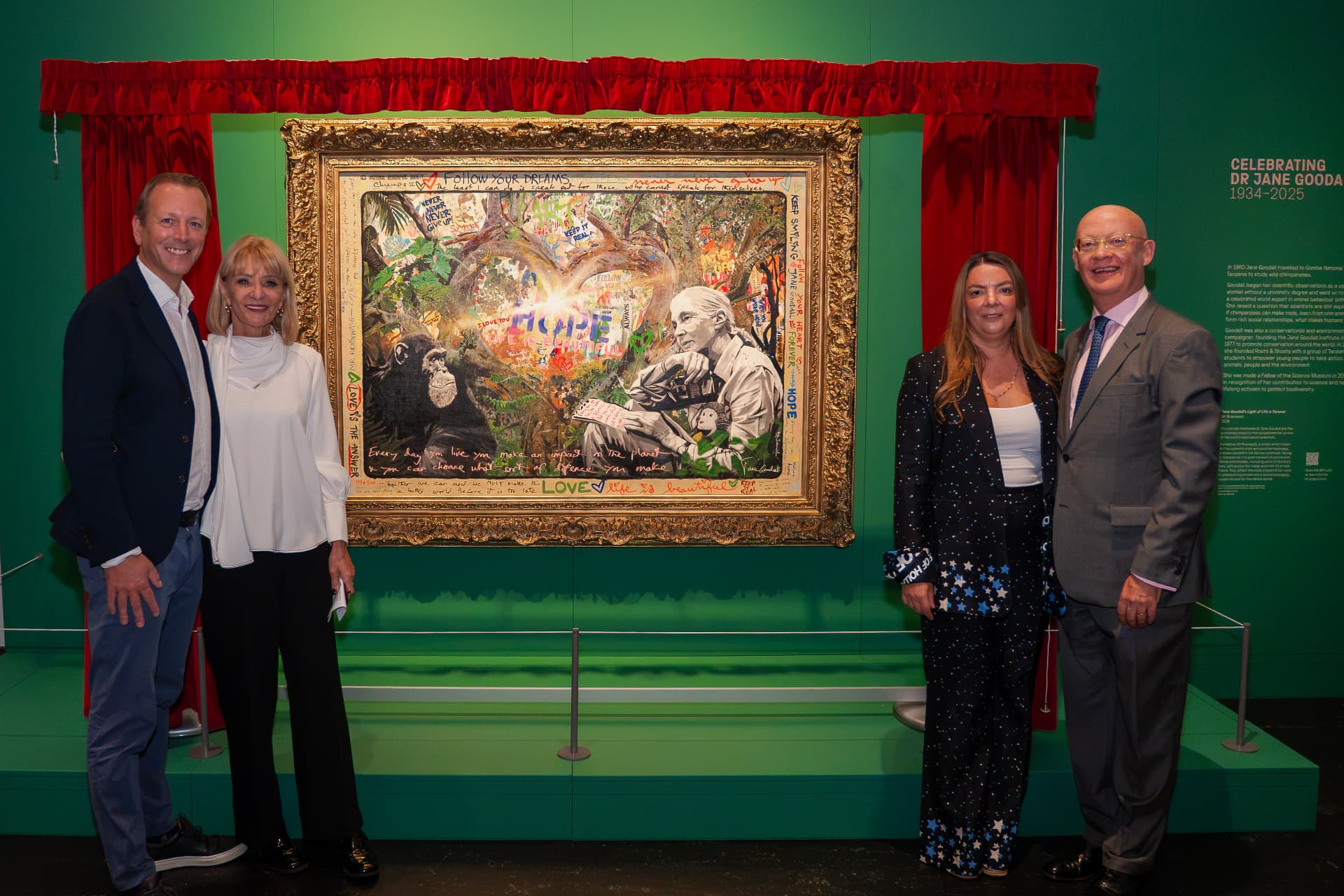 Guests beside the Mr Brainwash painting Jane Goodall's Light of Life Is Forever at the Science Museum