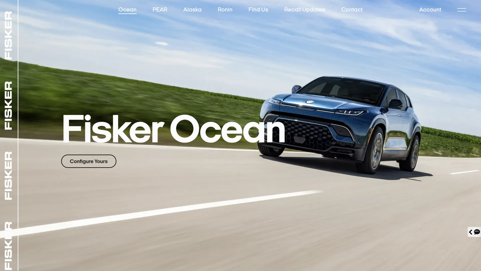 A black SUV driving on an open road with green fields and a blue sky, part of a website header for Fisker Ocean