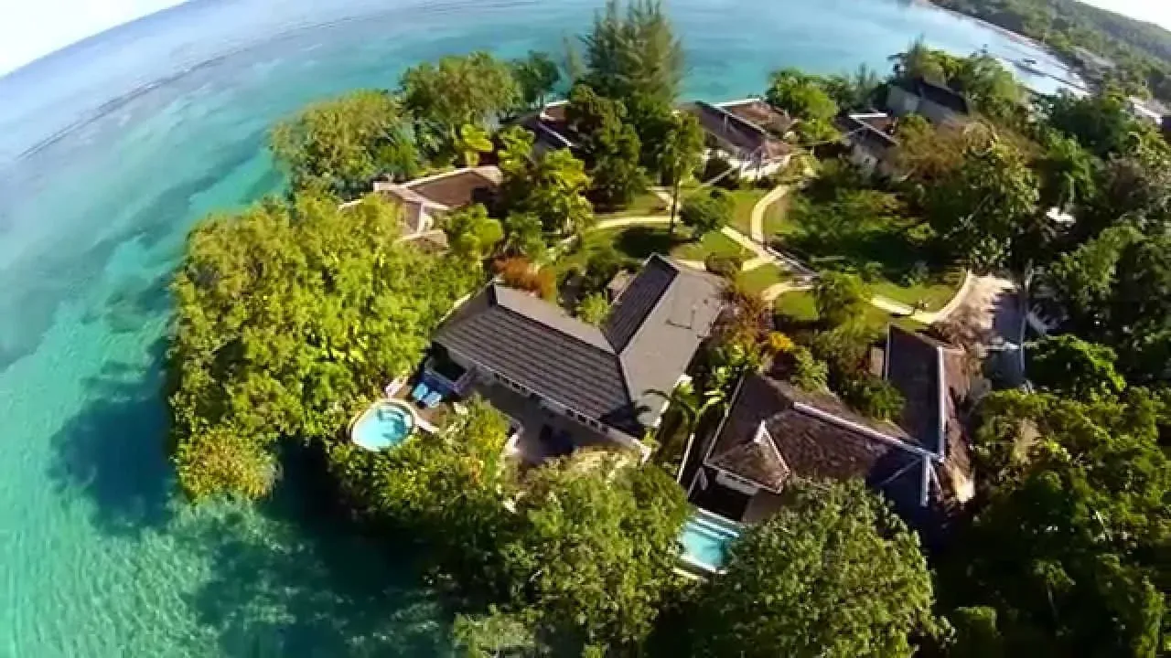 Aerial view of Jamaica Inn cottages above turquoise water